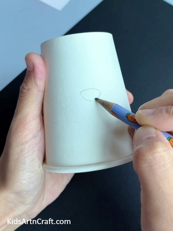Drawing A Bunny's Face- Crafting with children using a paper cup bunny and a carrot.